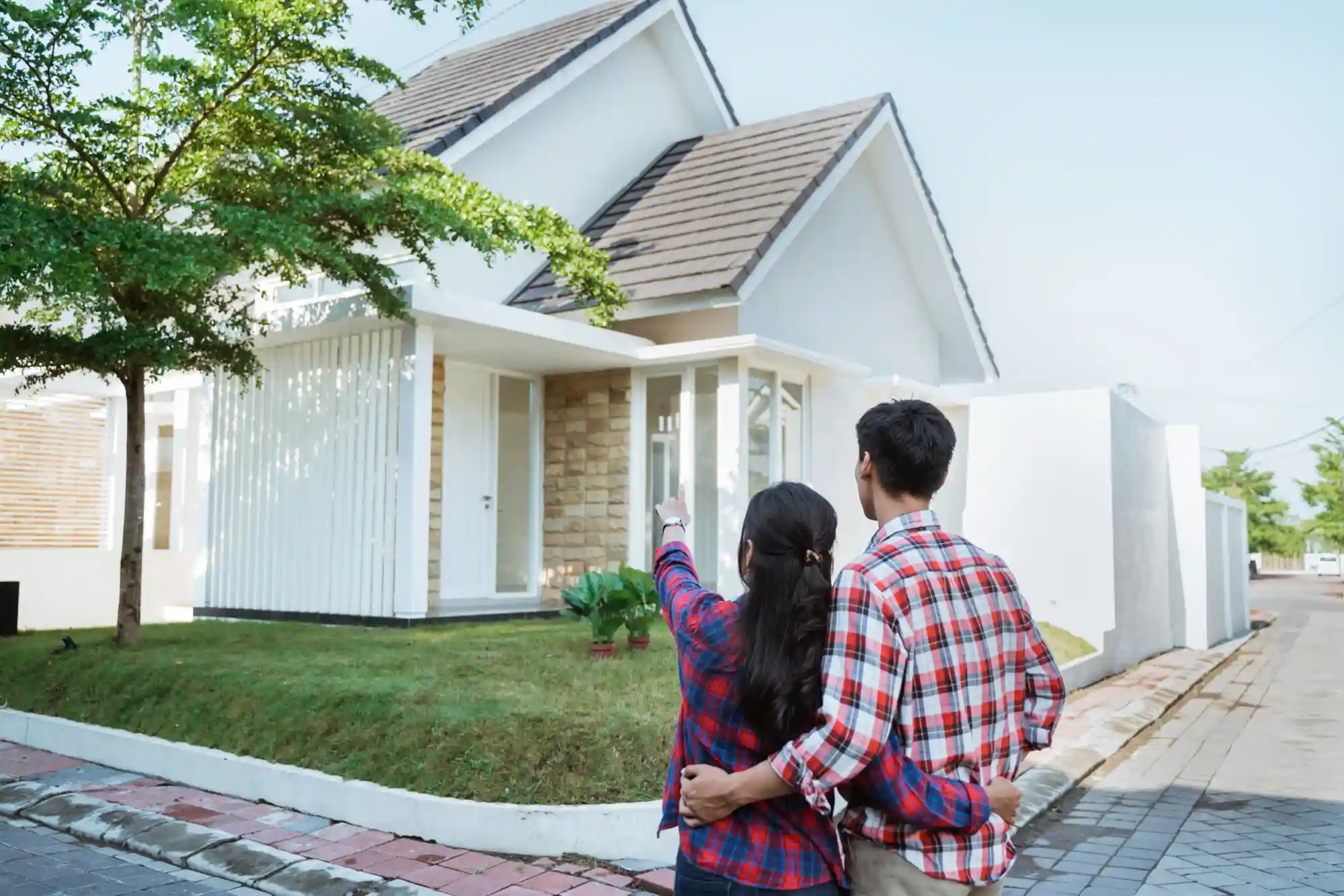 Happy couple reviewing their home loan options